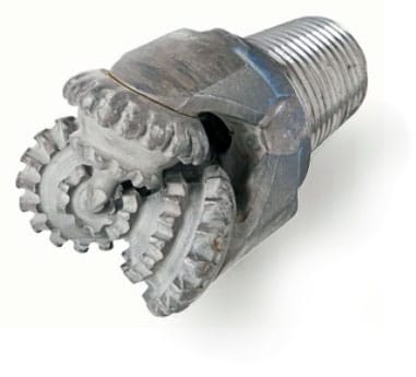 Close-up of a metal bolt with two interlocking gear wheels attached.